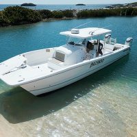 Boat along beach before snorkel and private boat charter in Puerto Rico by Pure Adventure